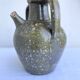 Ancient oil jar in glazed terracotta, khaki green — Auvergne, Lezou