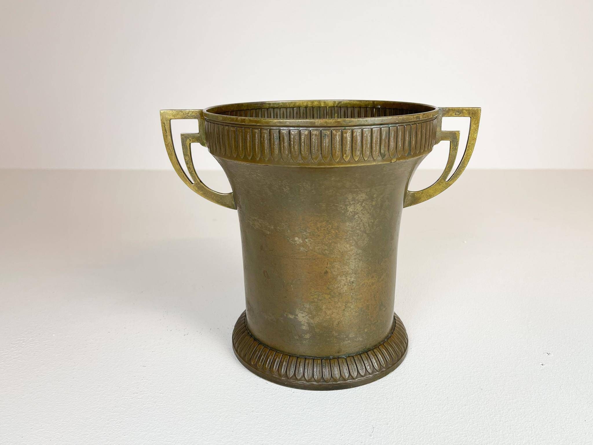 Art Deco champagne cooler in copper and brass with relief patterns, Sweden, 1930s.
