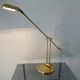 Articulated lamp Deknudt brass, 70s