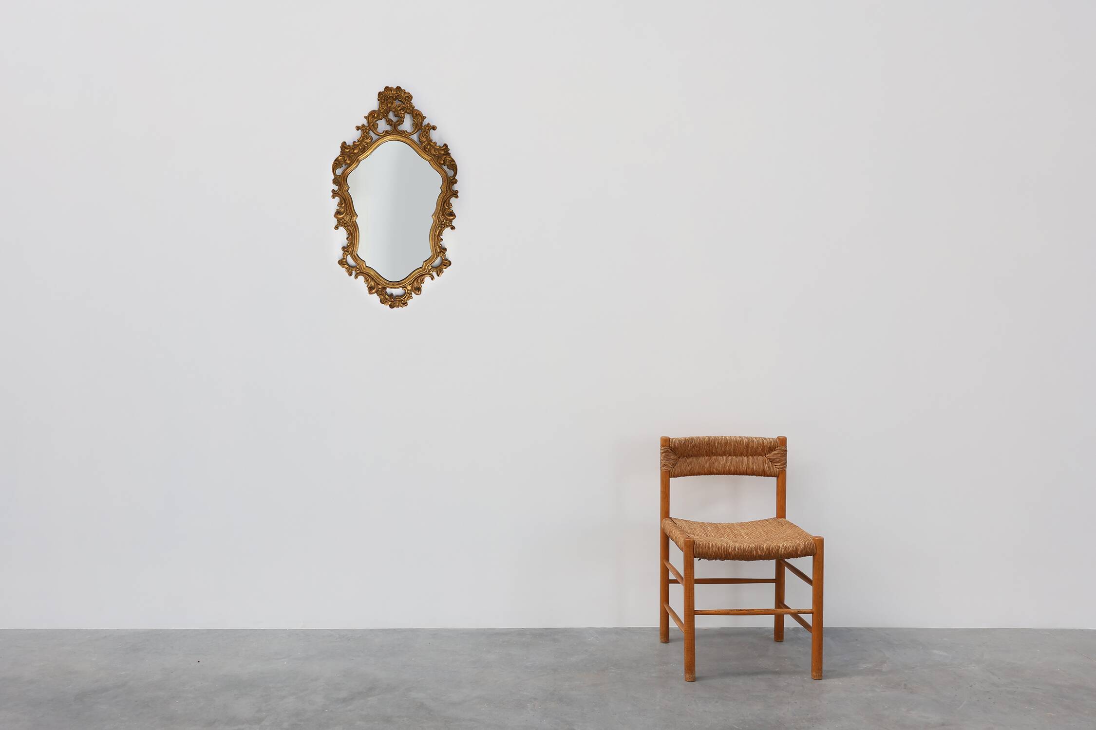 Baroque style oval wall mirror in gilded wood, France