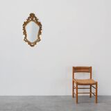 Baroque style oval wall mirror in gilded wood, France