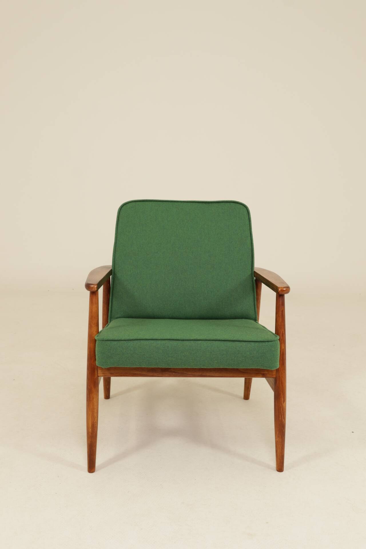 Scandinavian modern chair in green wool, vintage wooden armchair.