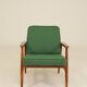 Scandinavian modern chair in green wool, vintage wooden armchair.