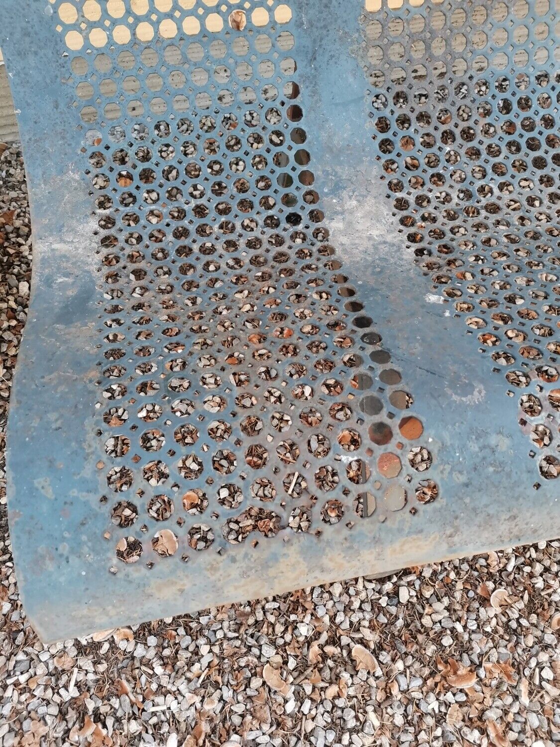 Former garden bench in perforated sheet metal