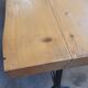 Large bistro table with a wooden top and cast iron legs - 2m56