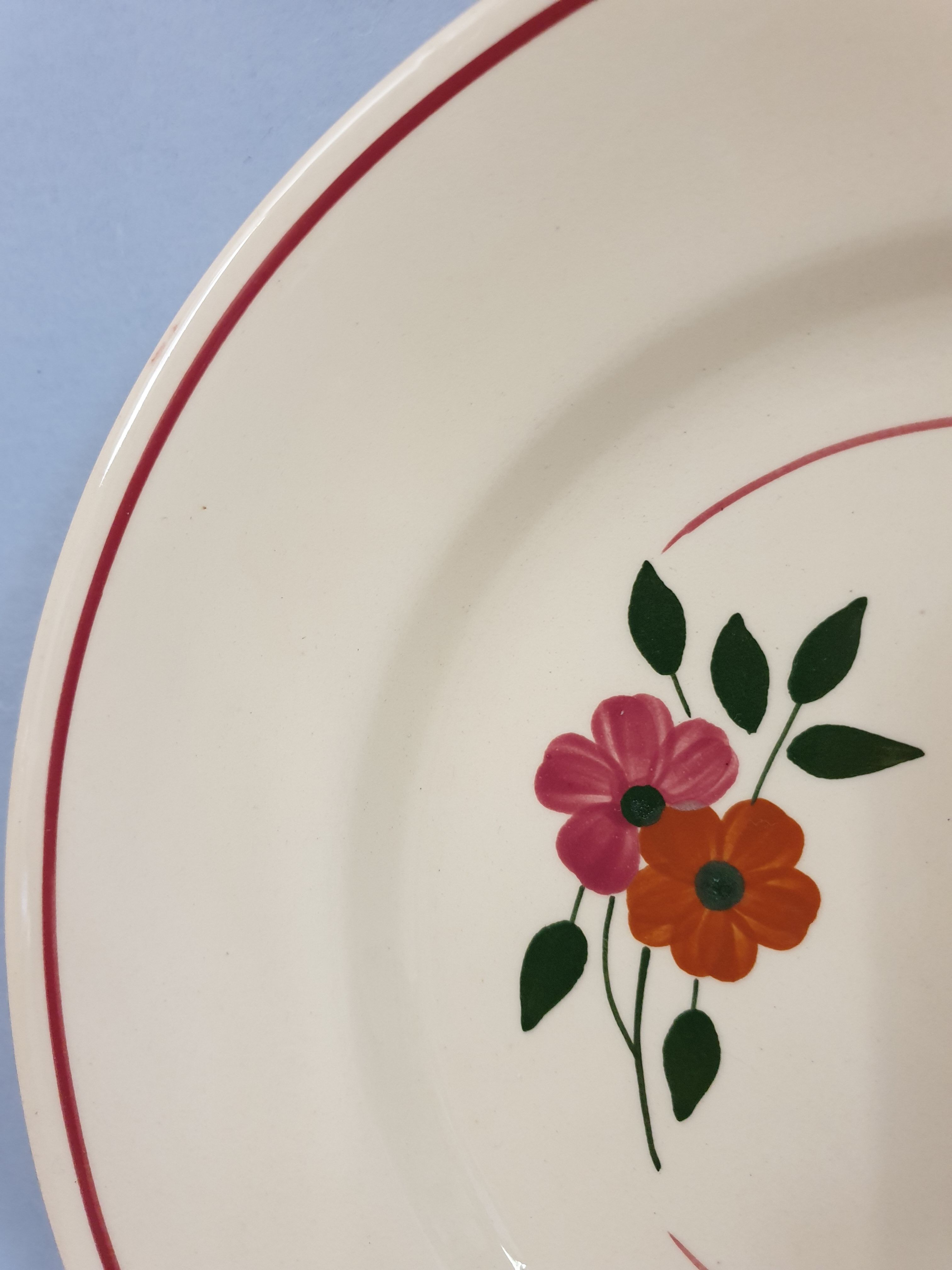 Set of 11 hand-painted earthenware plates