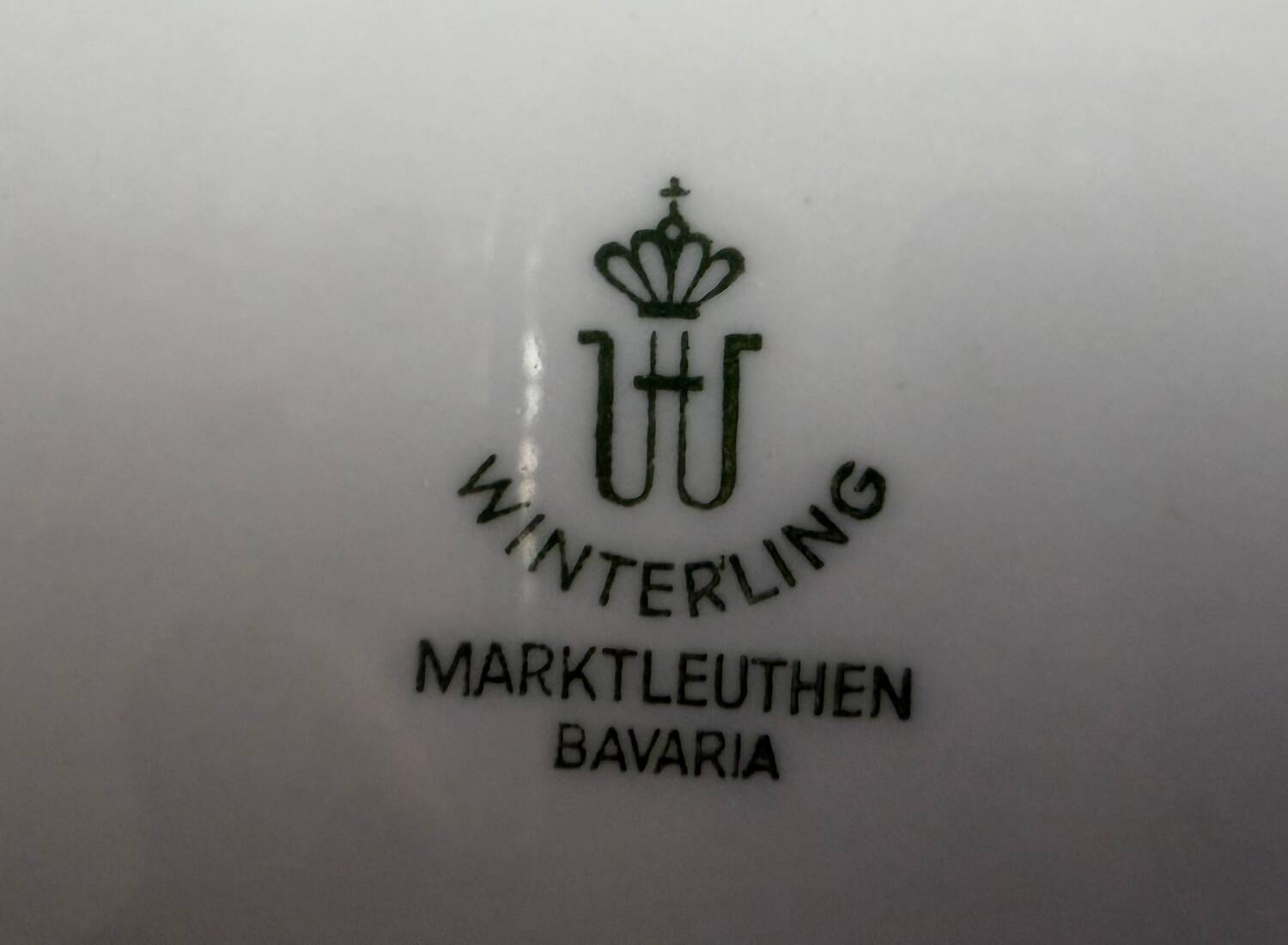 4 small oval porcelain dishes