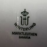 4 small oval porcelain dishes