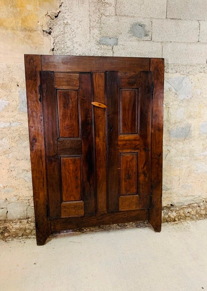 Old wooden doors of a Savoyard wardrobe chalet mountain vintage