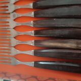 Set of 12 forks and 11 dessert knives from the 1950s. Wooden handles and box.