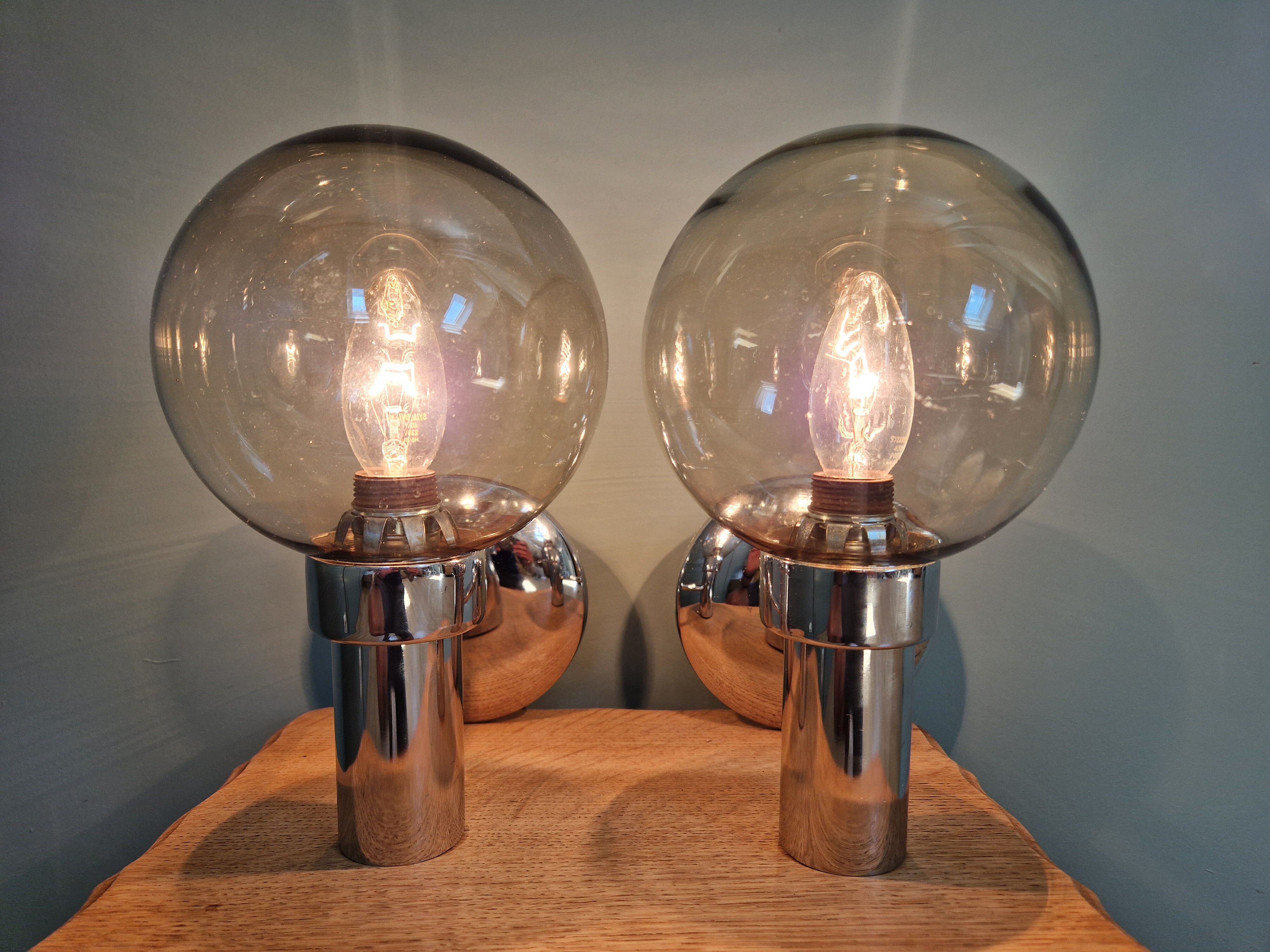 Pair of vintage wall lights in chromed metal and smoked glass, 70s