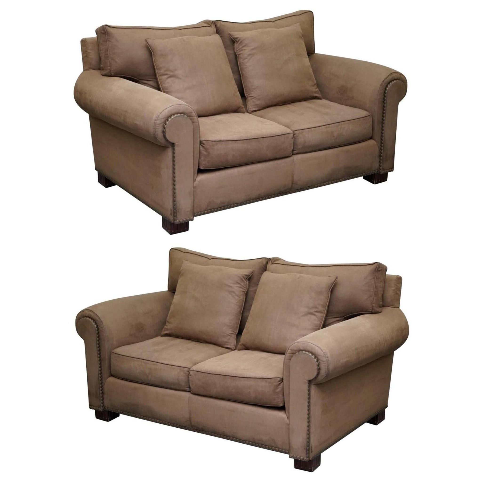 Ralph Lauren Jamaica velvet sofa pair with feather cushions.