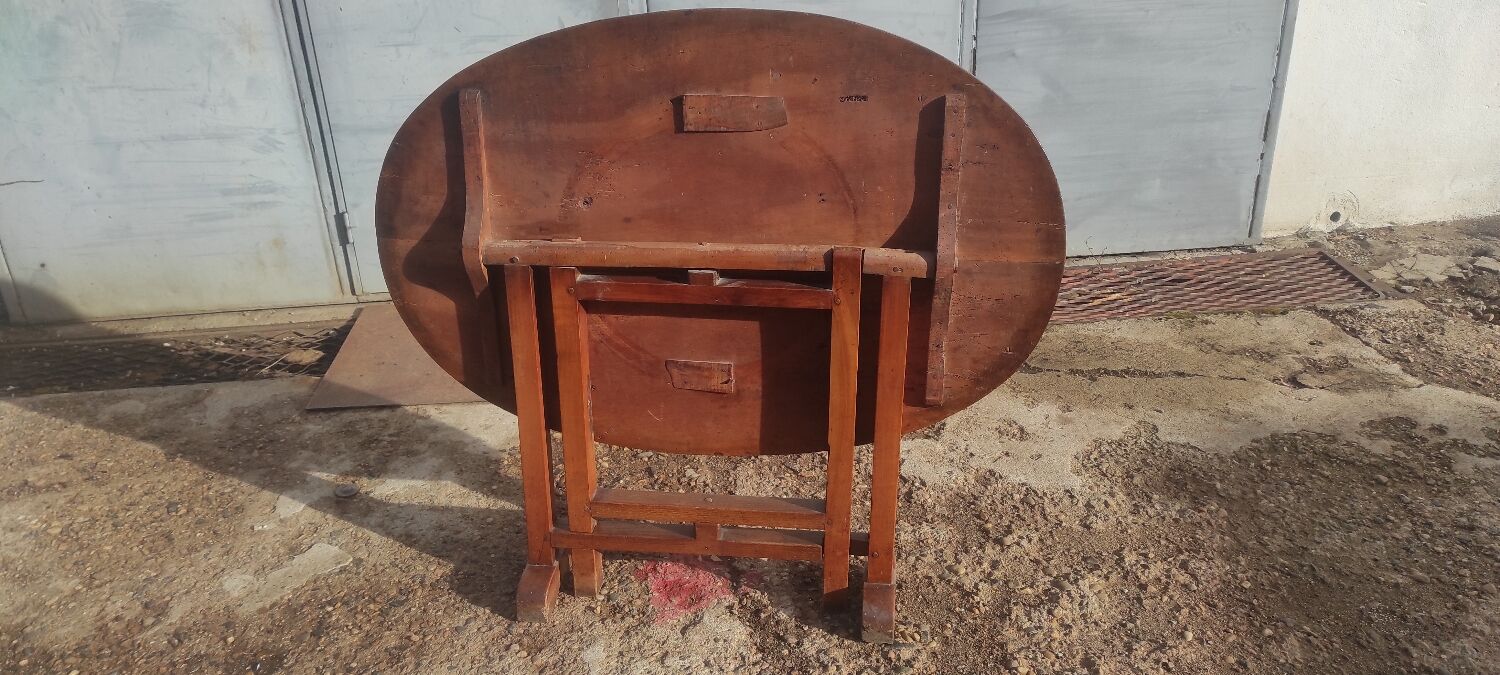 Old rustic oval folding wooden farmhouse table