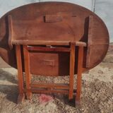 Old rustic oval folding wooden farmhouse table