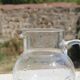 Vintage blown glass pitcher with bubbles, transparent.
