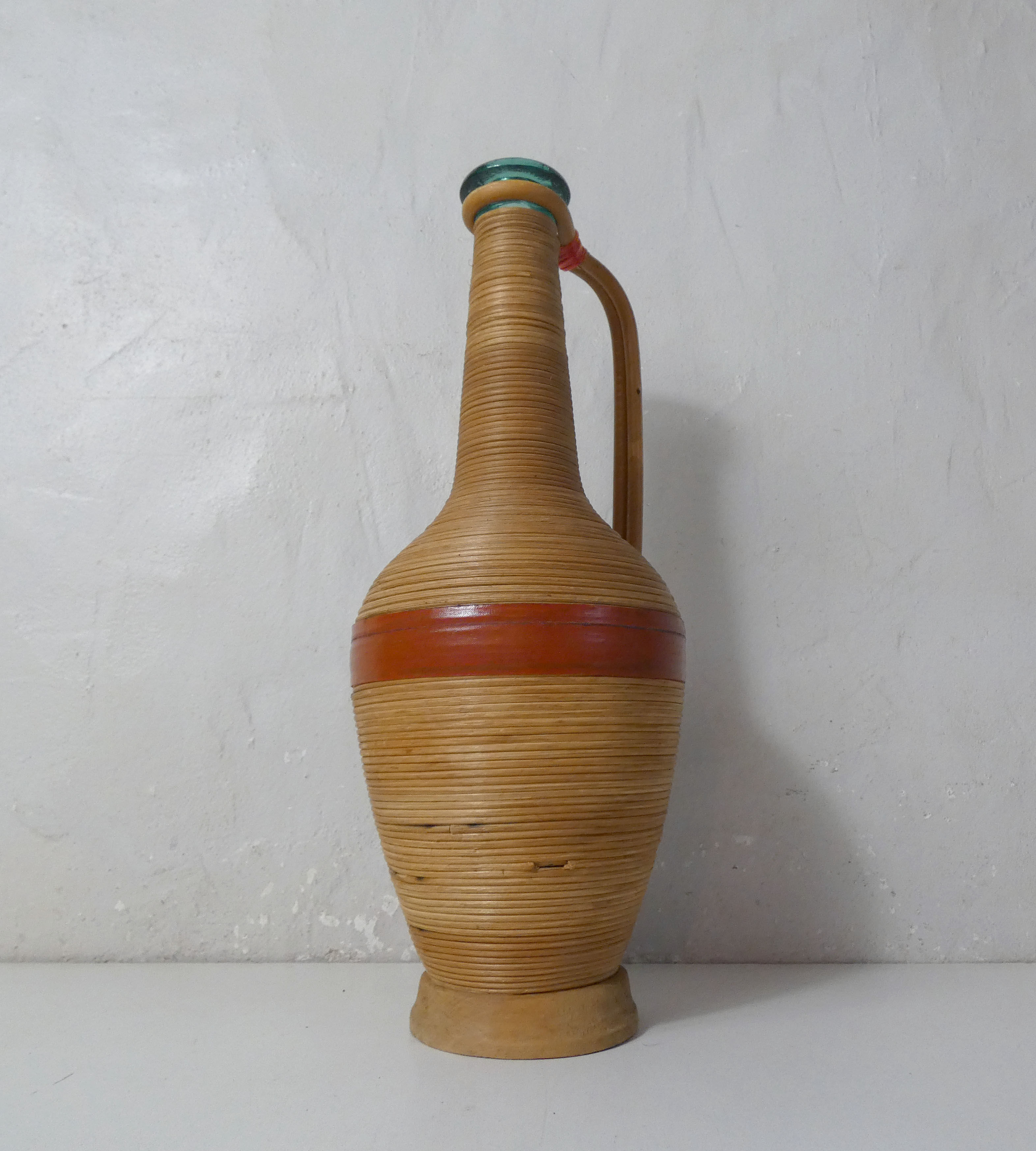 Old bottle dressed in vintage wood rattan