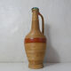 Old bottle dressed in vintage wood rattan