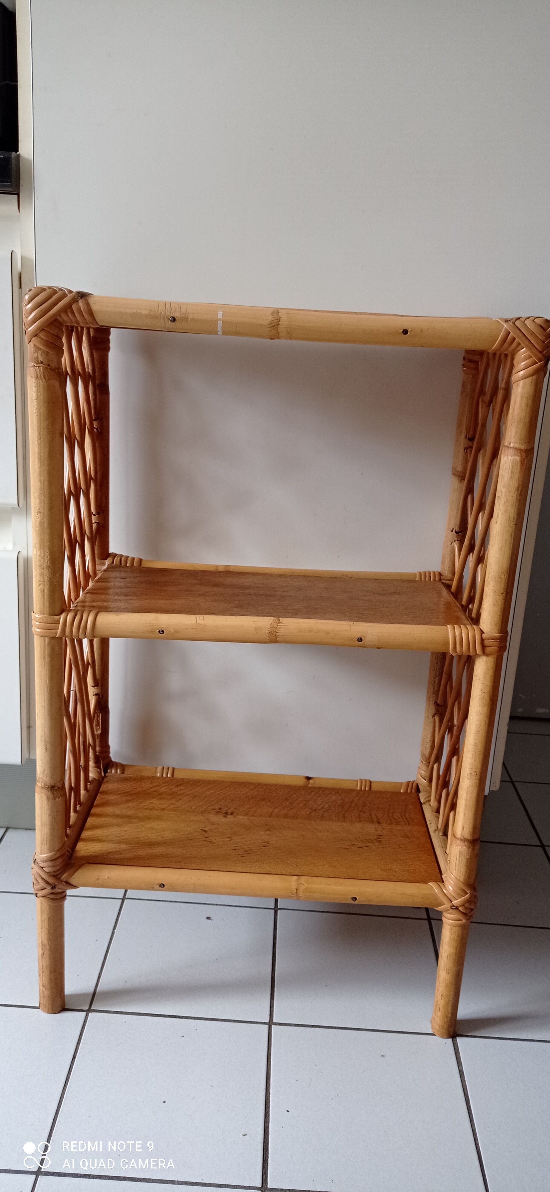 Old shelf on vintage rattan stands