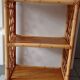 Old shelf on vintage rattan stands