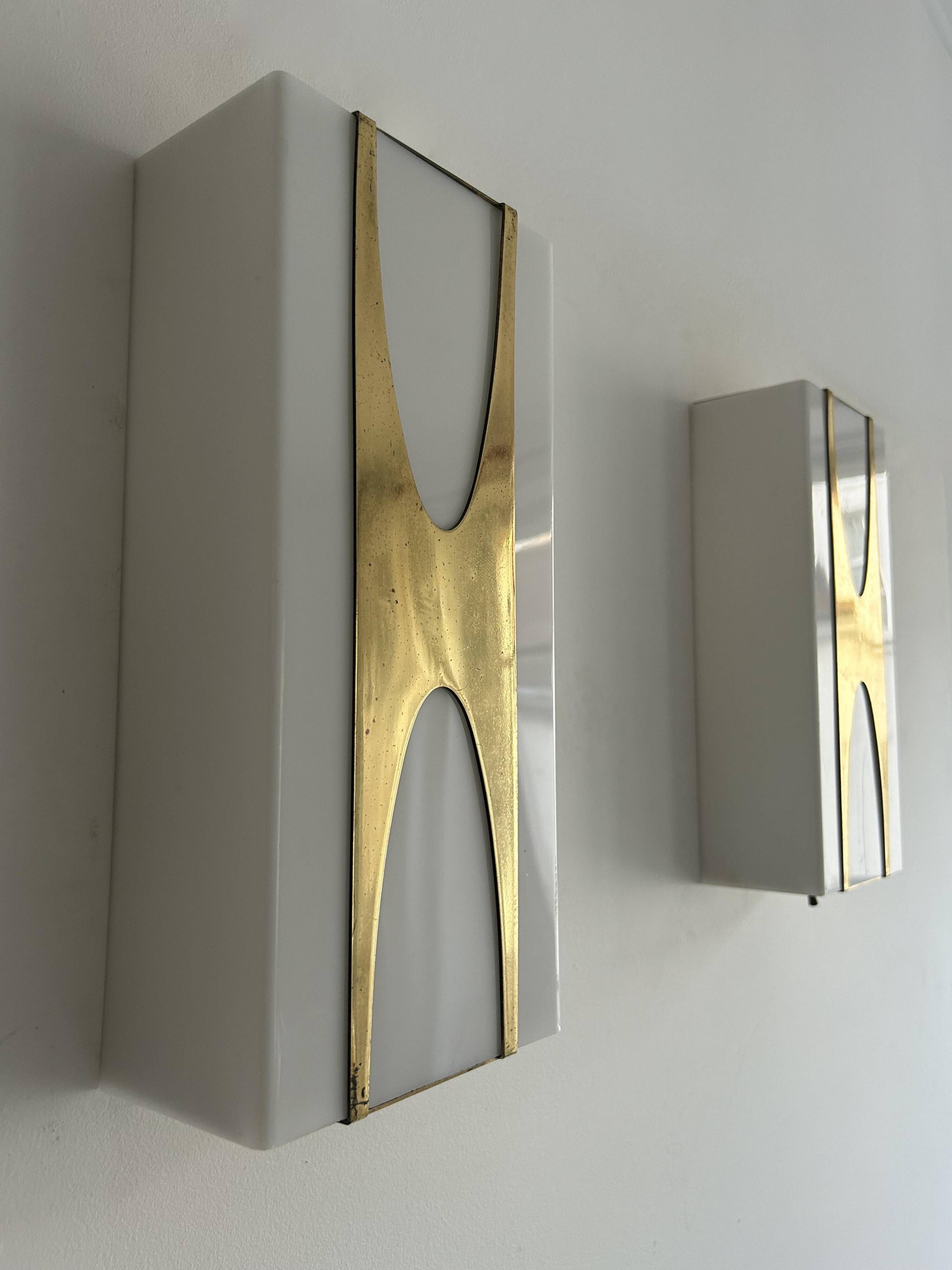 Pair of Loewy wall lights for Hilton, brass and Perspex, France 1965