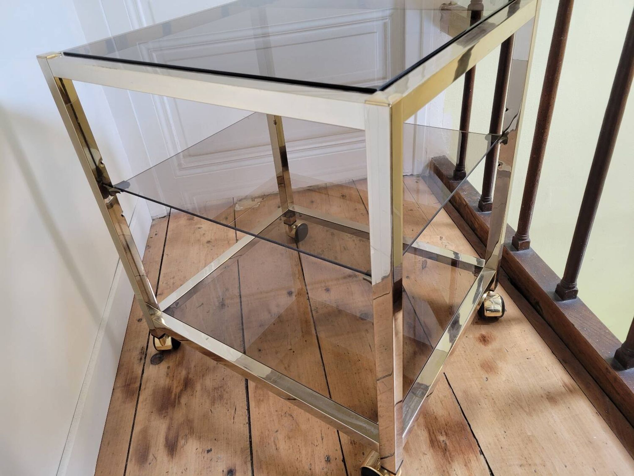 Gold metal and smoked glass serving trolley