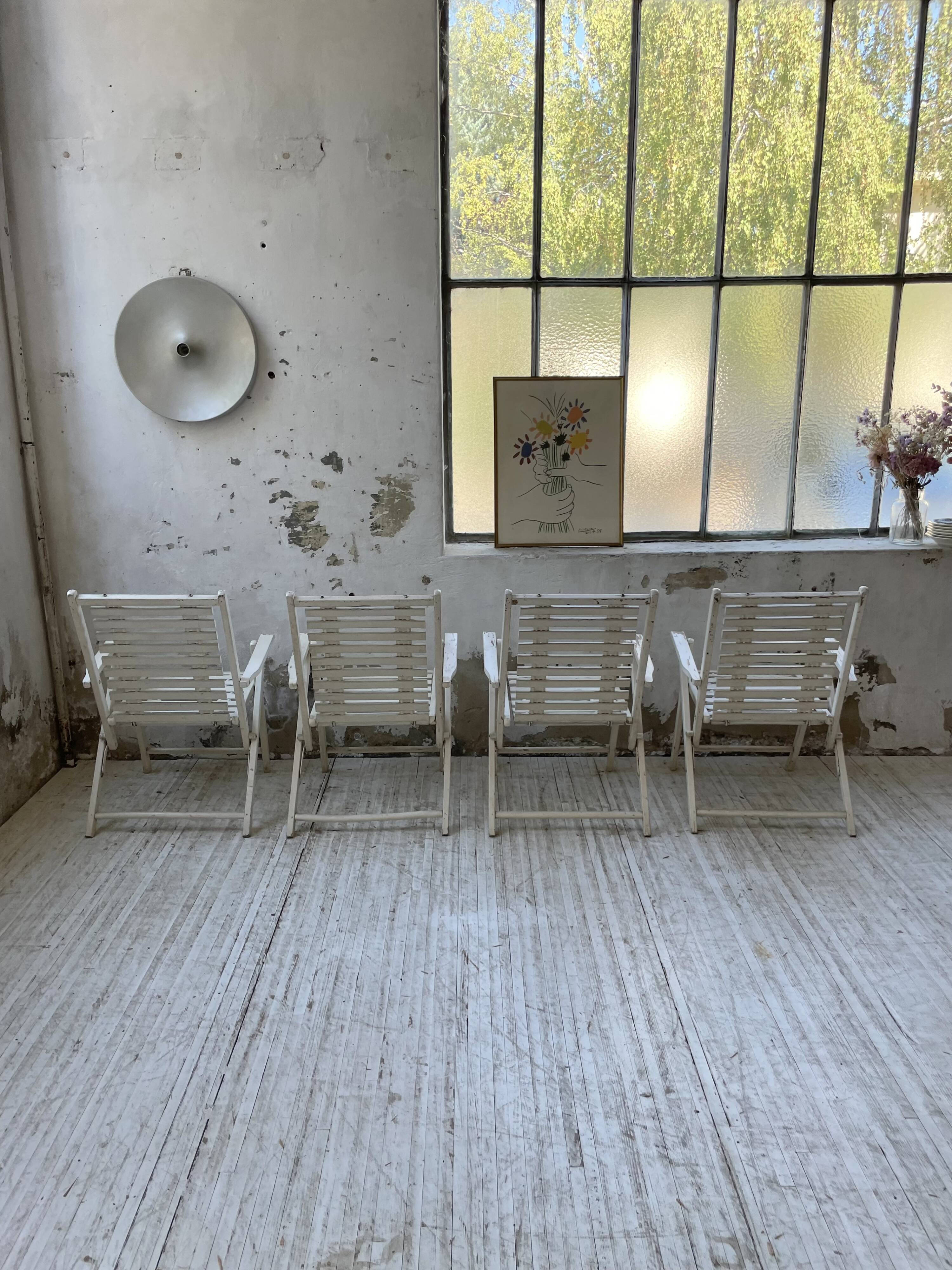 4 white wooden garden chairs
