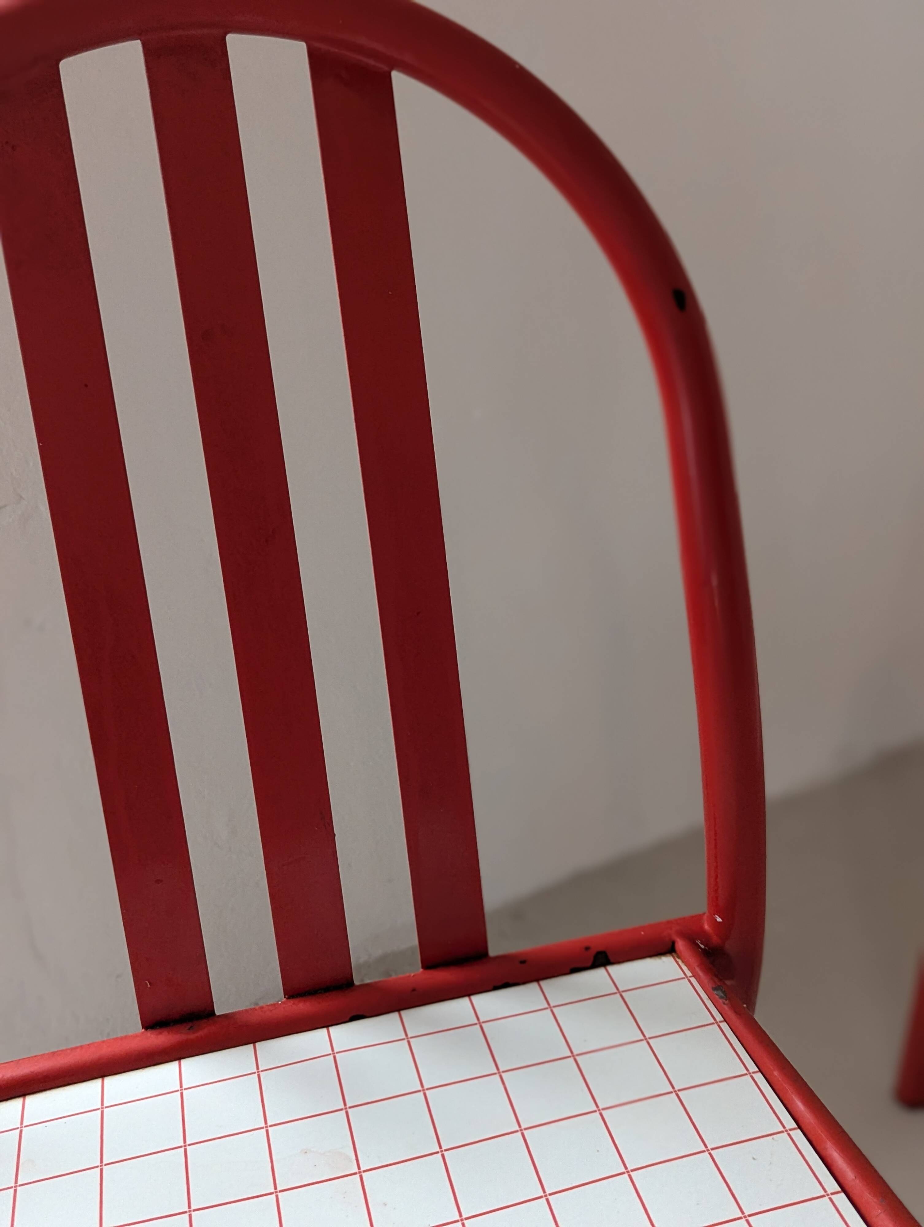 Set of 4 modernist red metal chairs