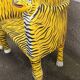 Wooden armchair with a "tiger" appearance.