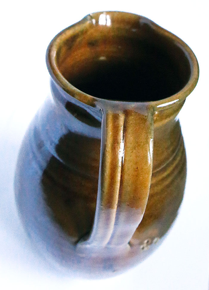 Pitcher of sandstone glaze degraded with chestnut and ochre