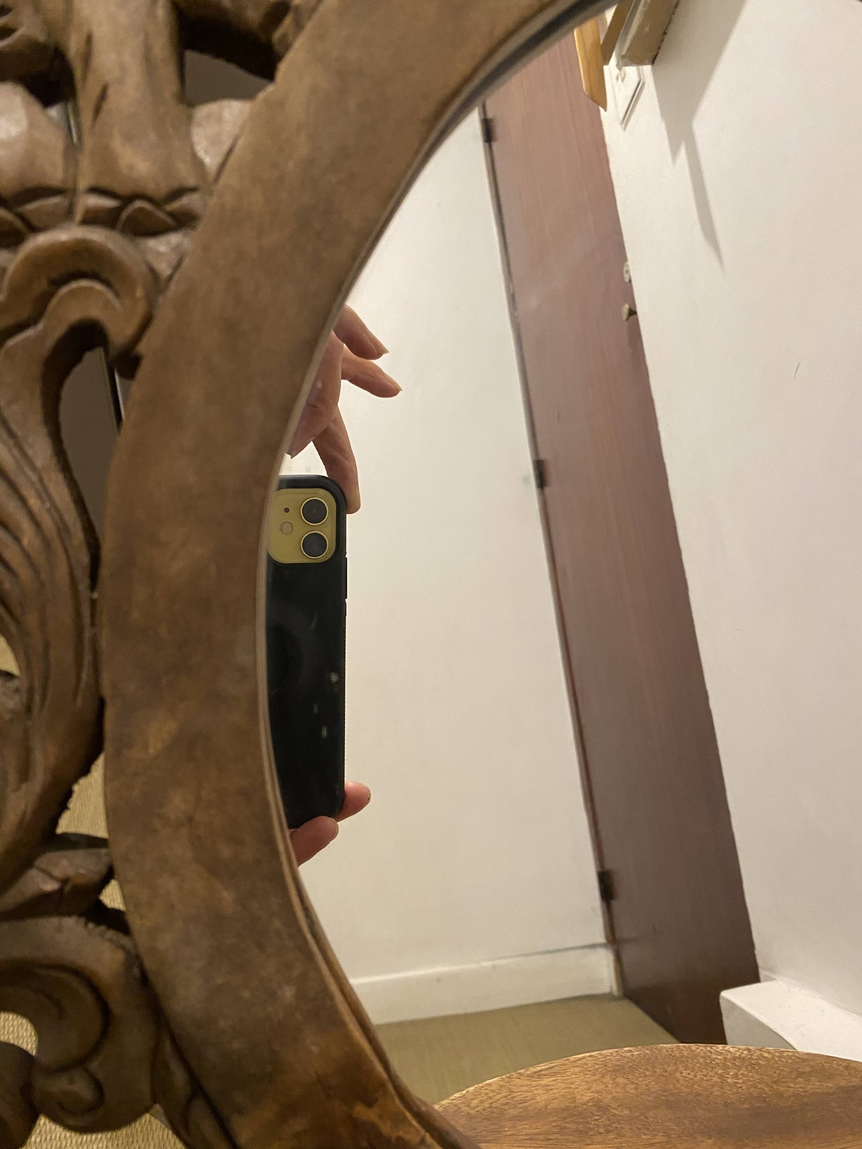 Carved mirror with integrated shelf