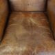 Cognac-colored sheepskin wing chair in English style