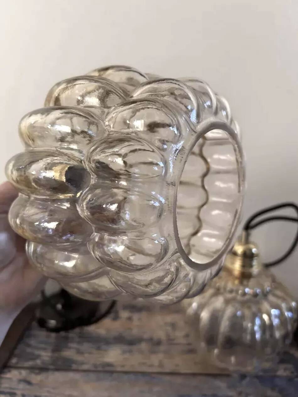 Set of two amber glass pendant lights