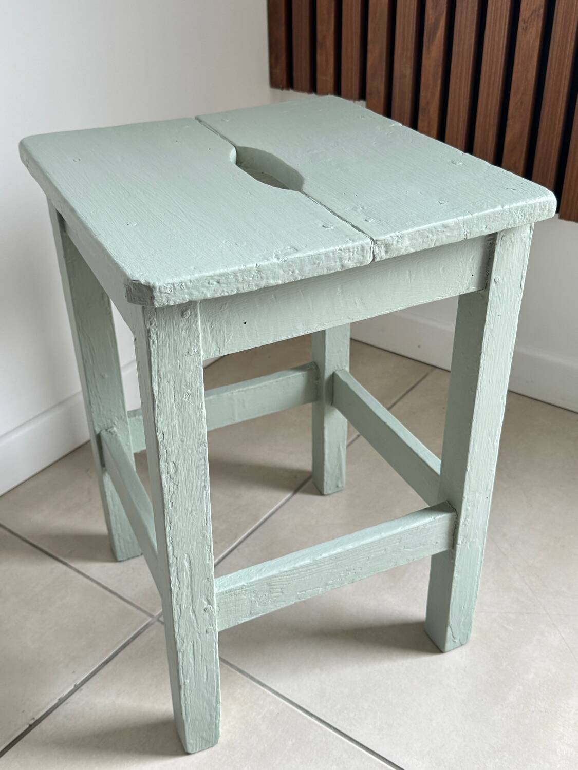Antique almond green wooden stool