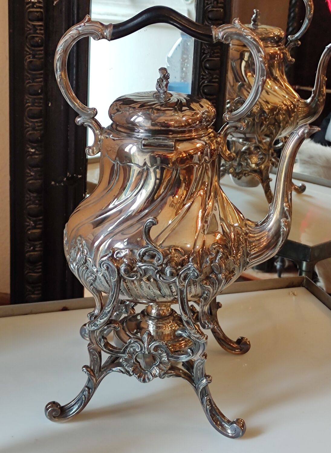 Ancient samovar tea fountain in silver metal