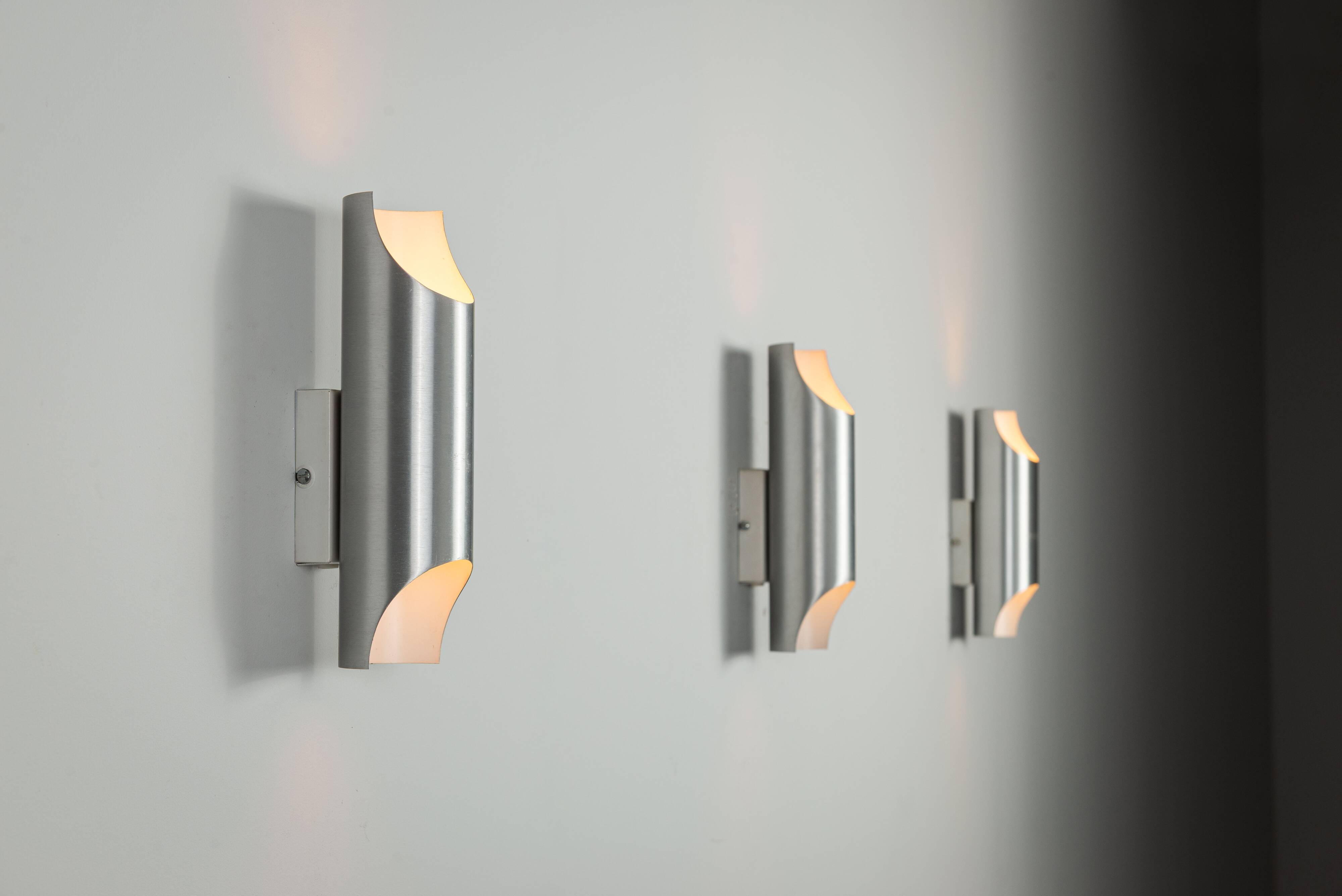 Set of three aluminium cylindrical wall lamps