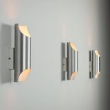 Set of three aluminium cylindrical wall lamps