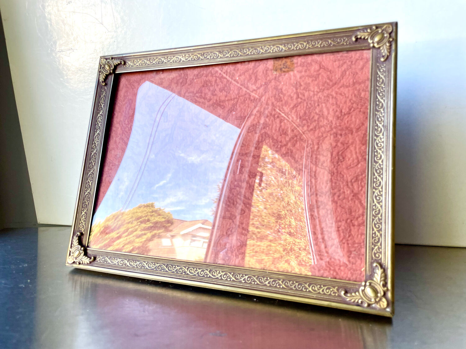 Metal frame in gold colored brass