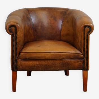 Very nice subtle sheep leather club armchair with beautiful colors and decorative nails