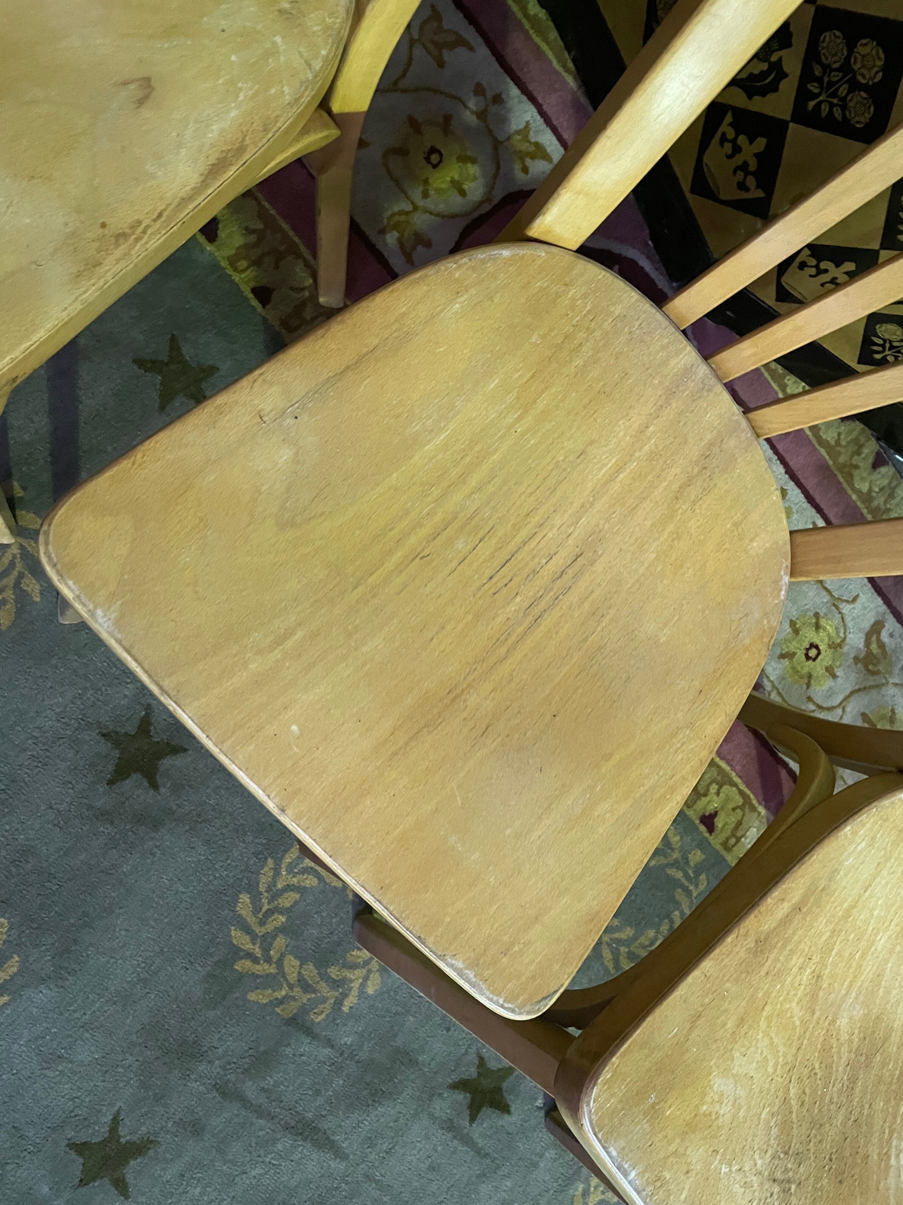 Suite of 6 bistro chairs signed "baumann"