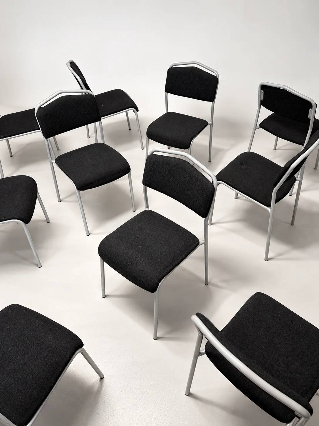 Grey steel chair and black fabric