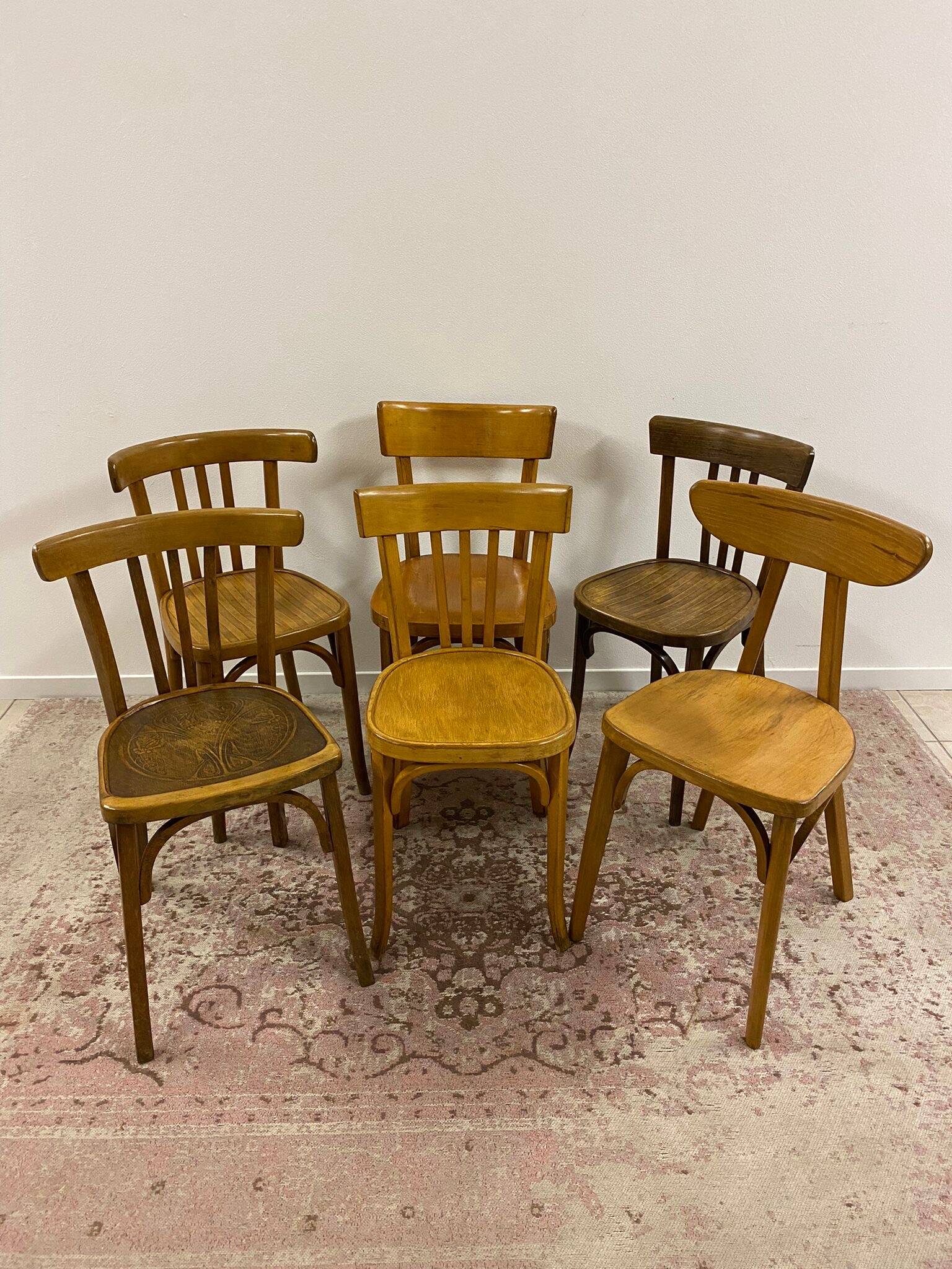 Set of 6 mismatched bistro chairs including Baumann and Luterma chairs