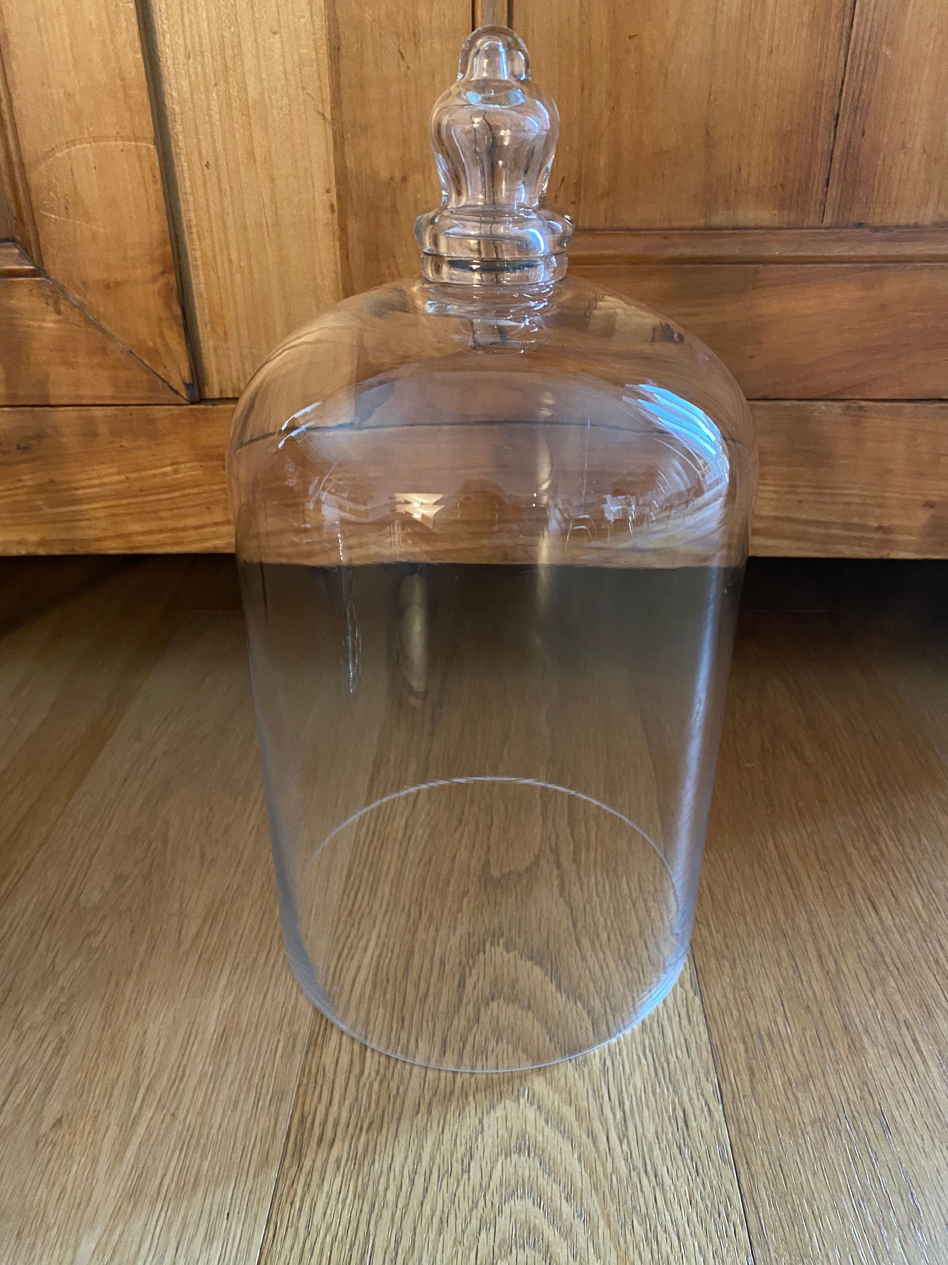Large old glass bell and its wooden base