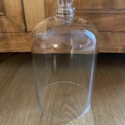 Large old glass bell and its wooden base