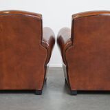 Very beautiful complete set consisting of a sheepskin leather sofa and two armchairs in cognac color