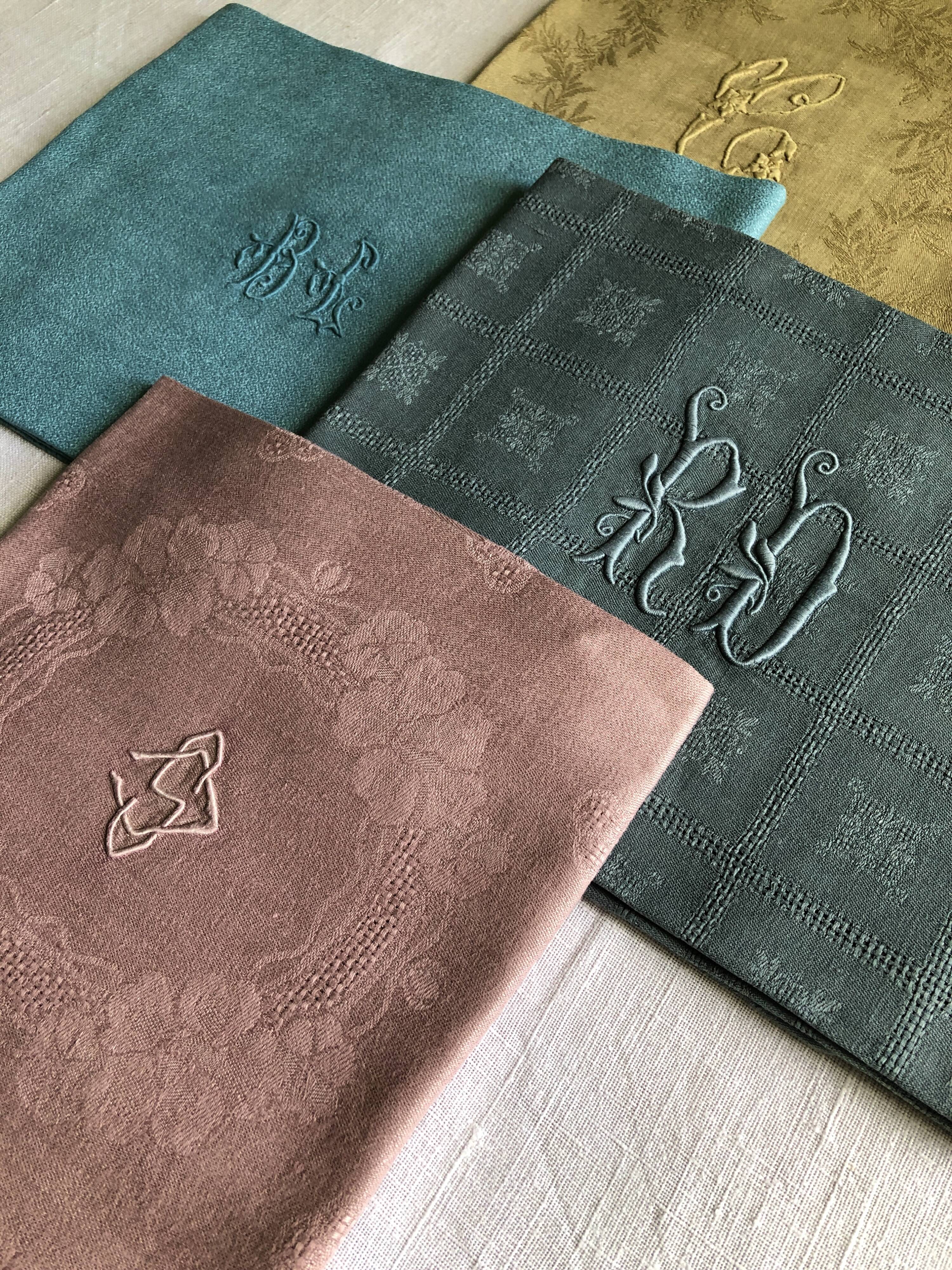 Suite of four tinted antique napkins