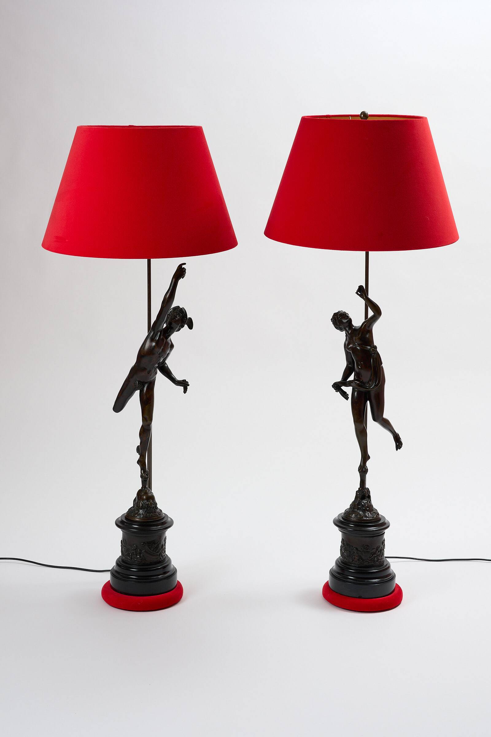 Pair of bronze lamps with red shades