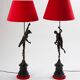 Pair of bronze lamps with red shades