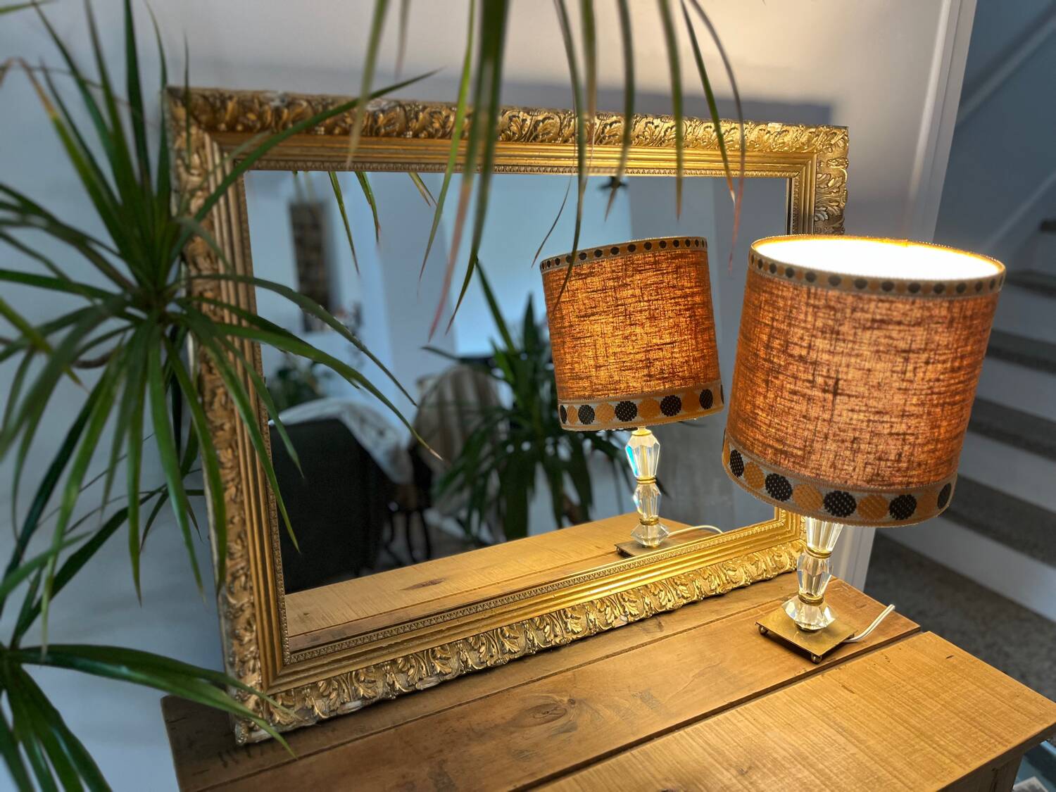 Antique mirror with a wooden and gilded stucco frame.
