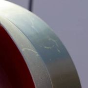 Carl Thore's Trava lamp in aluminium with an orange lacquered interior.