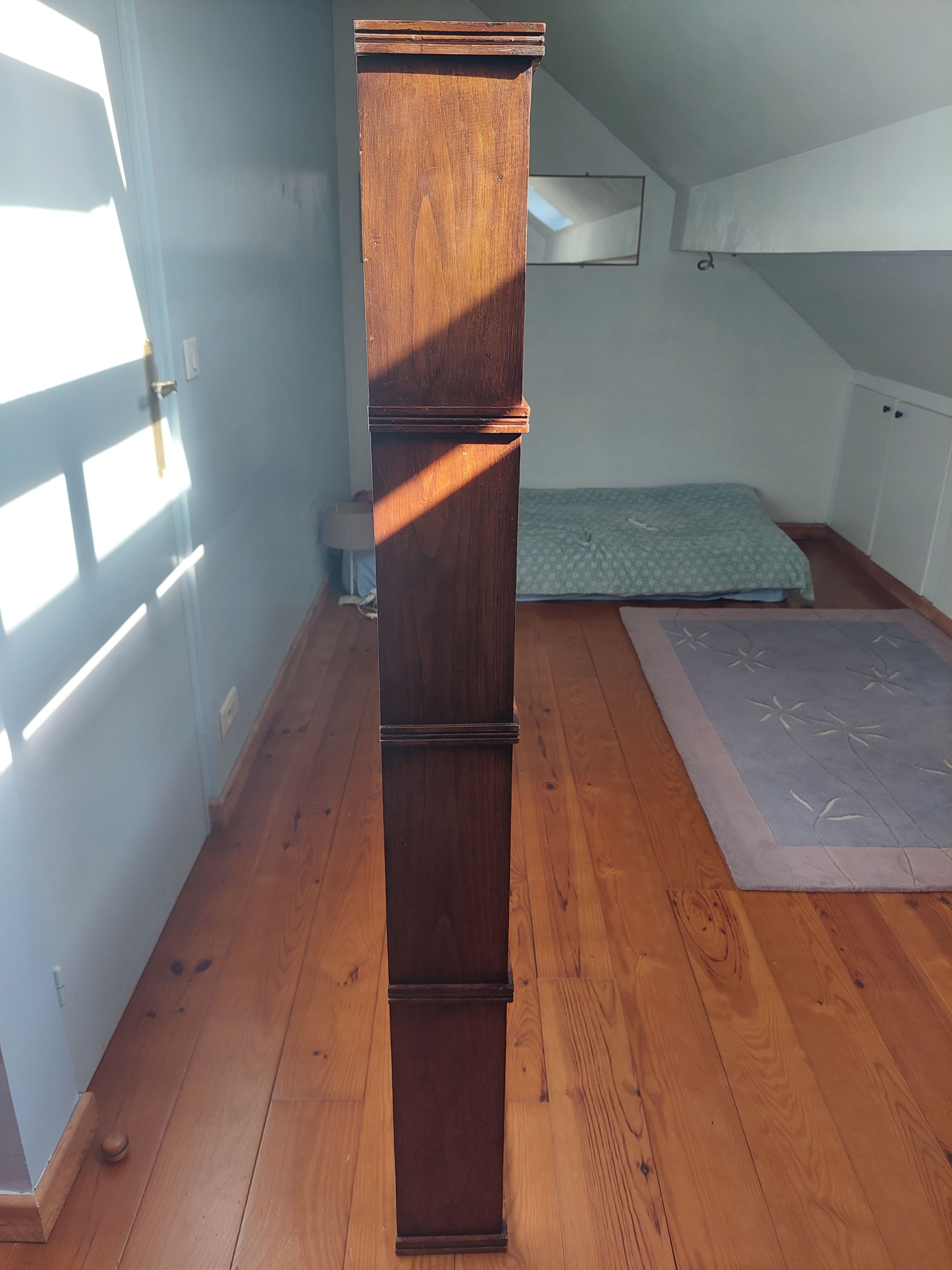 Asymmetrical wall or divider bookcase in dark wood